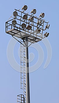 big floodlights of an industrial stadium plant on a steel pylon