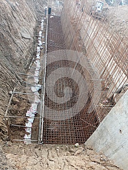 A big foundation made for reinforced cement concrete wall to retain soil embankment for road work