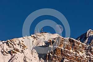 Big full moon over the Faloria mountain, Cortina D`Ampezzo, Ital photo