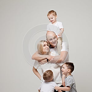 Big and funny family, mom, dad and three sons. Happy together.