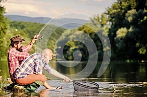 Big game fishing. fly fish hobby of men. retirement fishery. happy fishermen friendship. Two male friends fishing