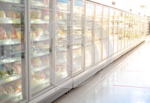 Big glass door deep freezer refrigerater at supermarket