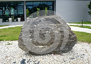 A big gneiss metamorphic rock stone for outdoor garden decoration.