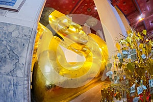 Big gold buddha statue at Wat Phra Non Chaksi, Singburi, Thailand. Beautiful of historic city at buddhism temple