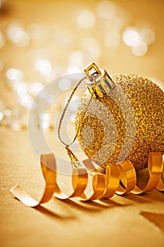Big gold colored christmas bauble very close up view