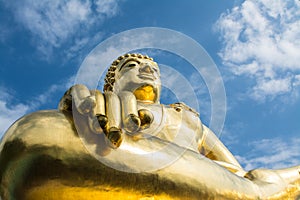 Big golden buddha statue with blue sky at Golden Triangle, Thailand