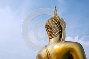 The big golden Buddha statue with clear blue sky