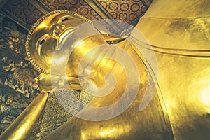 The Big golden . BuddhaThe Reclining Buddha at Wat Pho Pho Temple in Bangkok, Thailand photo