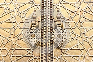 Big golden doors of the royal palace of Fes, Morocco. Design, luxury.