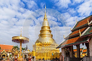Big golden pagoda in public temple wat phra that hariphunchai at lamphun thailand