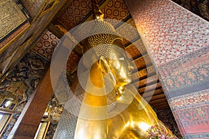 The Big golden Reclining Buddha within Wat Pho is the important