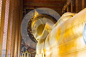 The Big golden Reclining Buddha within Wat Pho is the important