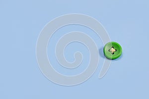 Big green button on a blue background