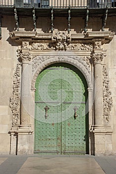 Big green portal in old town of Alicante, Spain