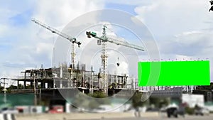 Big green screen billboard and construction site