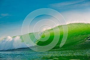 Big green wave in ocean. Breaking wave