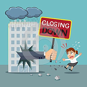 Big hand shows a closing down sign to a businesswoman