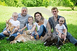 Big happy family with dogs and cat