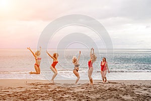 Big happy family or group of five friends is having fun against sunset beach. Beach holidays concept.