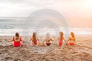 Big happy family or group of five friends is having fun against sunset beach. Beach holidays concept.