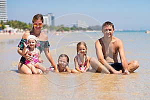 Big happy family is having fun at beach. concept of a large family at sea.beach fashion.