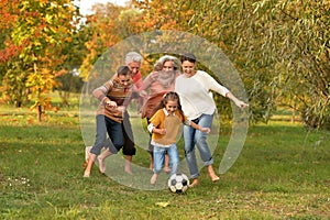 Big family playing football photo