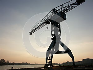 Big harbor crane at sunset