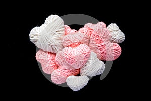 Big heart of small pink and white wool yarn heart shape isolated