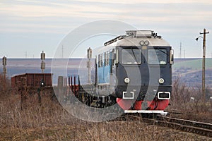 Big heavy train locomotive, pulling the cargo. photo