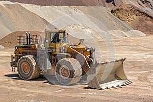 Big heavy yellow bulldozer at construction site.