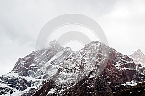 Big and high mountains in Central Asia, Tajikistan. with snow adn clounds