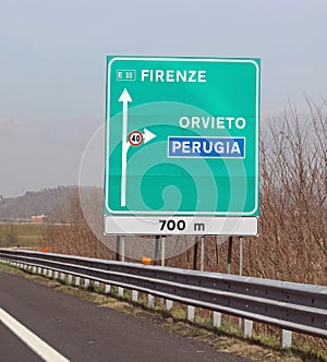 big highway signs with italian text with name of city photo