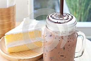 Big iced cocoa glass on wooden