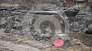 Big industrial excavator digging up ground, urban development. Bulldozer scoop working in construction site