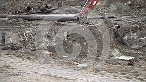 Big industrial excavator digging up ground, urban development. Bulldozer scoop working in construction site