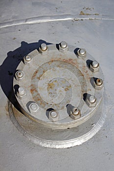 Big industrial flange with nuts