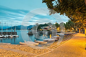 Big Italian lake at dawn. Lake Maggiore and Laveno with its small port