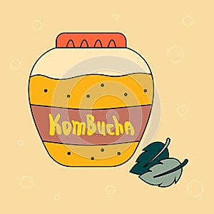 Big jar of refreshing kombucha drink and mint leaves