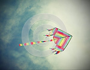 Big kite flies in the sky with vintage old effect