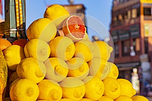 Big Lemons at market in Marrakesh, Morocco. Yellow tropical fruits in Africa. The background is blur. It is a booth to prepare