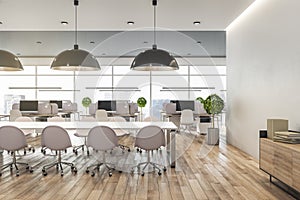 BIg light conference table in the center of modern open space office with wooden floor and furniture and city view