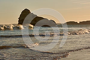 Big limestone rock washed by ocean waves at sunset. PortimÃ£o, Portugal