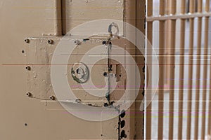 Big lock on prison door with bars photo