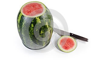 Big watermelon with cut off tip on a white background photo