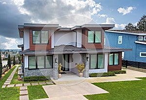 Big luxury residential house on cloudy sky background