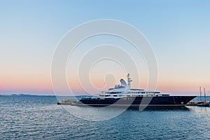 Big luxury super motor yacht at dock of the port