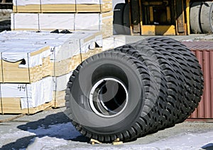 Big machines tires stack background.