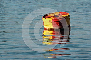 Big metal buoy in water