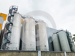 Big metal insulated cold storage containers with spiral staircase and bridge