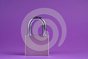 Guardian of Security: Silver Metal Padlock on Vibrant Purple Background